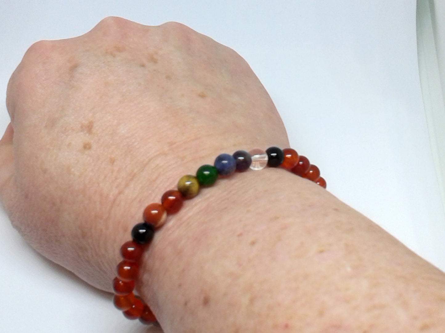 Chakra Bracelet - 1 sequence Surrounded by Carnelian 6 mm beads